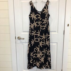 Jumpsuit wide leg button up black cream tropical leaf print. Beachy flowy rayon